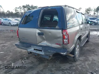 1999 GMC Yukon with VIN 1GKEK13R8XJ804104, listed as a IAAI auction lot 41359701 with 296,522 mi miles. Bid and sale history available at carsss.com. Image 6.