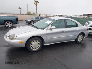 1997 Mercury Sable GS z VIN 1MELM50U8VG603194, wystawiony jako IAAI lot #41558010 z przebiegiem 265 169 mil mil oraz . Historia ofert i sprzedaży dostępna na DreamBid. Obrazek 12.