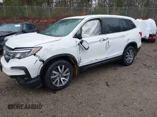 2022 Honda Pilot EX-L with VIN 5FNYF6H54NB020832, listed as a IAAI auction lot 40916277 with 58,441 mi miles. Bid and sale history available at carsss.com. Image 2.