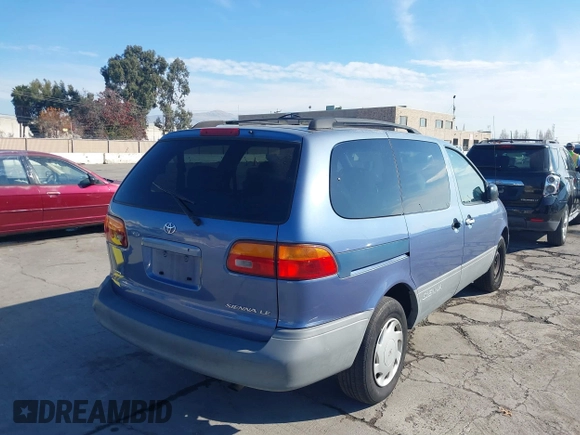 1999 Toyota Sienna LE with VIN 4T3ZF13C2XU126738, listed as a IAAI auction lot 41012127 with 218,080 mi miles. Bid and sale history available at carsss.com. Image 4.
