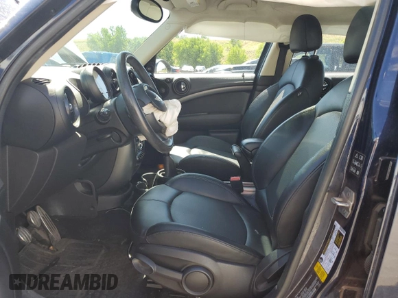 2016 MINI Countryman S with VIN WMWZC5C54GWT38489, listed as a Copart auction lot 63834335 with 102,564 mi miles and Salvage title. Bid and sale history available at DreamBid. Image 7.