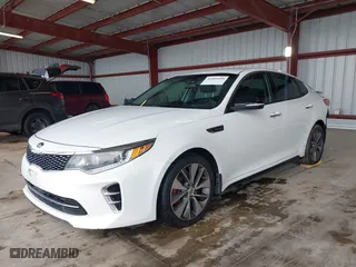 2017 Kia Optima SX with VIN 5XXGW4L2XHG136843, listed as a IAAI auction lot 41806606 with 157,899 mi miles. Bid and sale history available at carsss.com. Image 2.