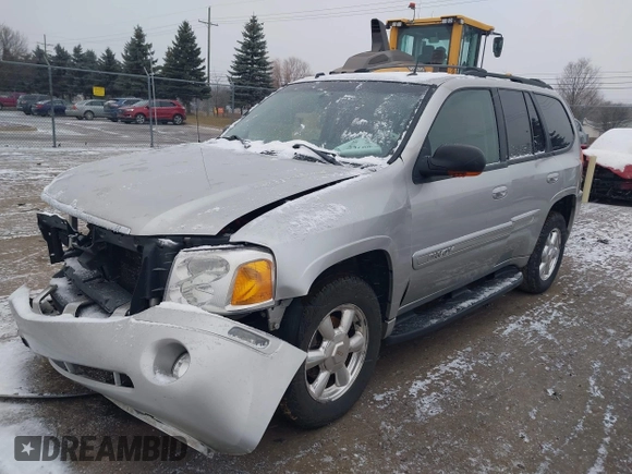 2005 GMC Envoy SLT with VIN 1GKDT13S352258640, listed as a IAAI auction lot 41226997 with 159,665 mi miles. Bid and sale history available at carsss.com. Image 2.
