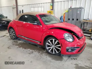 2015 Volkswagen Beetle with VIN 3VW7S7AT1FM822318, listed as a Copart auction lot 71398644 with 73,421 mi miles and Salvage Title. Bid and sale history available at DreamBid. Image 4.