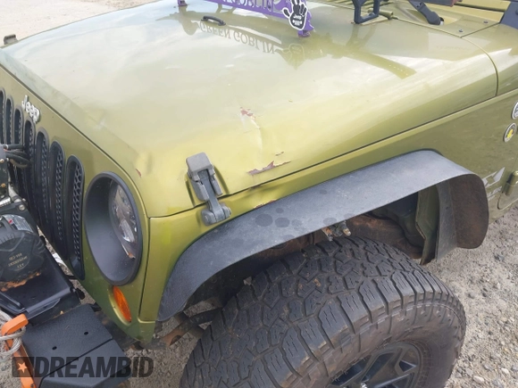 2007 Jeep Wrangler Unlimited X with VIN 1J4GA39177L164566, listed as a IAAI auction lot 42588655 with 50,915 mi miles and . Bid and sale history available at DreamBid. Image 6.