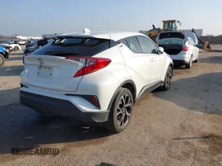2021 Toyota C-HR LE with VIN JTNKHMBXXM1099019, listed as a IAAI auction lot 41525170 with 63,519 mi miles. Bid and sale history available at carsss.com. Image 4.