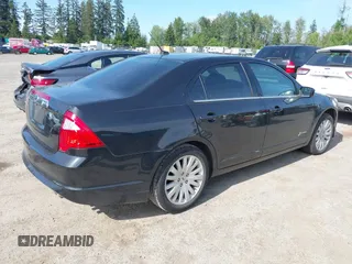 2012 Ford Fusion Hybrid z VIN 3FADP0L31CR380821, wystawiony jako IAAI lot #42332256 z przebiegiem 59 431 mil mil oraz . Historia ofert i sprzedaży dostępna na DreamBid. Obrazek 4.