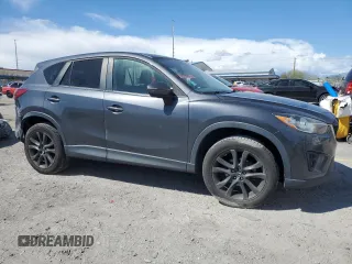 2015 Mazda CX-5 Grand Touring with VIN JM3KE4DY9F0536771, listed as a Copart auction lot 51801775 with 88,529 mi miles and Salvage Title. Bid and sale history available at DreamBid. Image 4.