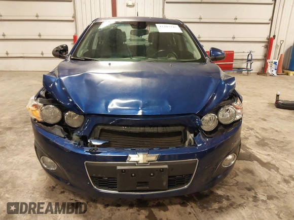 2012 Chevrolet Sonic LTZ z VIN 1G1JE5SB4C4214450, wystawiony jako IAAI lot #42207345 z przebiegiem 120 152 mil mil oraz . Historia ofert i sprzedaży dostępna na DreamBid. Obrazek 13.