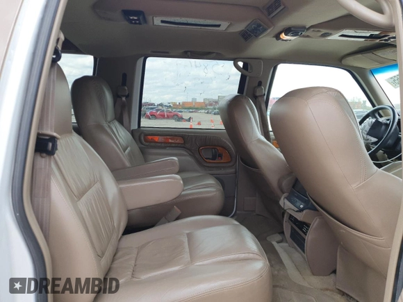 1999 Chevrolet Suburban with VIN 3GNEC16R9XG143471, listed as a Copart auction lot 53856565 with 208,621 mi miles and Salvage title. Bid and sale history available at DreamBid. Image 11.