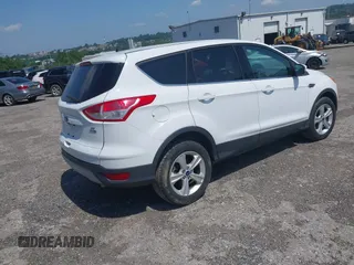 2014 Ford Escape SE with VIN 1FMCU9GX9EUC61521, listed as a IAAI auction lot 42535244 with 129,315 mi miles and . Bid and sale history available at DreamBid. Image 4.