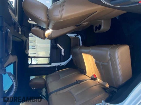 2014 Jeep Wrangler Unlimited Sahara with VIN 1C4BJWEG1EL272951, listed as a Copart auction lot 51147245 with 56,989 mi miles and Clean Title. Bid and sale history available at carsss.com. Image 6.