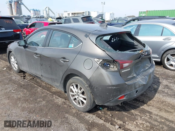 2014 Mazda 3 i Grand Touring with VIN JM1BM1M75E1207754, listed as a IAAI auction lot 41698583 with 128,887 mi miles and . Bid and sale history available at DreamBid. Image 3.