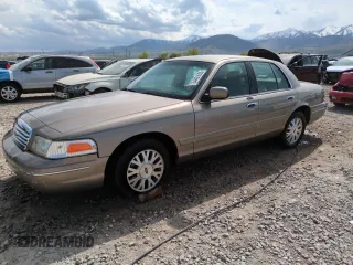 2003 Ford Crown Victoria LX z VIN 2FAHP74W43X155250, wystawiony jako Copart lot #54431655 z przebiegiem 128 601 mil mil oraz Szkody całkowita. Historia ofert i sprzedaży dostępna na DreamBid. Obrazek 1.