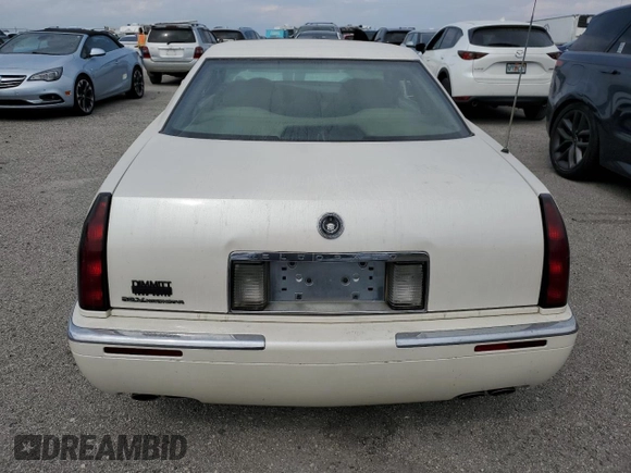 1999 Cadillac Eldorado z VIN 1G6EL12Y7XU615169, wystawiony jako Copart lot #76459744 z przebiegiem Nie podano mil oraz Szkoda całkowita • Salvage title. Historia ofert i sprzedaży dostępna na DreamBid. Obrazek 6.