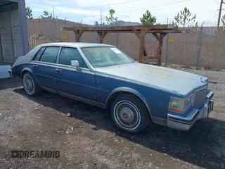 1985 Cadillac Seville z VIN 1G6KS698XFE804240, wystawiony jako IAAI lot #42125052 z przebiegiem 11 322 mil mil oraz . Historia ofert i sprzedaży dostępna na DreamBid. Obrazek 1.
