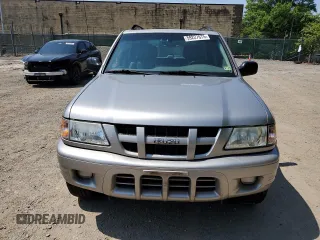 2004 Isuzu Rodeo z VIN 4S2DM58Y144302204, wystawiony jako Copart lot #59227675 z przebiegiem 98 998 mil mil oraz Czysty tytuł • Clean title. Historia ofert i sprzedaży dostępna na DreamBid. Obrazek 5.