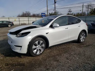 2023 Tesla Model Y Long Range z VIN 7SAYGDEE0PA065923, wystawiony jako Copart lot #45916165 z przebiegiem 53 401 mil mil oraz Szkoda całkowita • Salvage title. Historia ofert i sprzedaży dostępna na DreamBid. Obrazek 1.