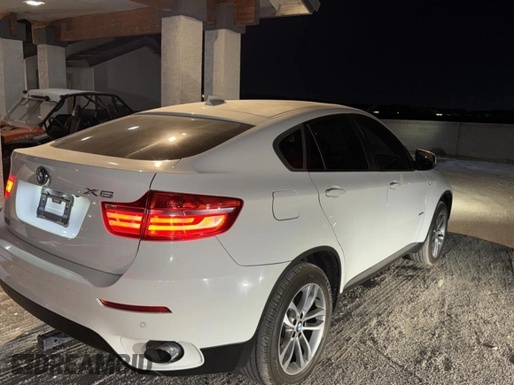 2014 BMW X6 xDrive35i with VIN 5UXFG2C58E0H09681, listed as a Copart auction lot 83922494 with 120,170 mi miles and Salvage Title. Bid and sale history available at carsss.com. Image 4.
