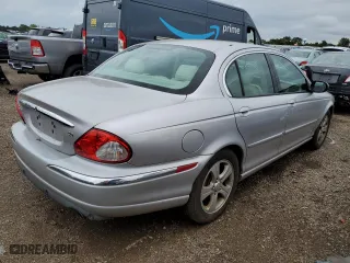 2002 Jaguar X-Type with VIN SAJEA51C02WC20249, listed as a Copart auction lot 69661244 with 97,184 mi miles and Clean Title. Bid and sale history available at carsss.com. Image 3.