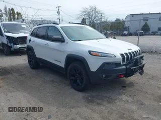 2014 Jeep Cherokee Trailhawk with VIN 1C4PJMBS5EW240375, listed as a IAAI auction lot 41806725 with 127,705 mi miles. Bid and sale history available at carsss.com. Image 1.