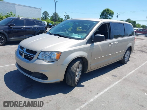 2015 Dodge Grand Caravan American Value with VIN 2C4RDGBG3FR647957, listed as a IAAI auction lot 42147813 with 129,859 mi miles and . Bid and sale history available at DreamBid. Image 2.