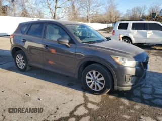 2015 Mazda CX-5 Touring with VIN JM3KE2CY0F0439125, listed as a Copart auction lot 43324945 with 210,404 mi miles and Clean Title. Bid and sale history available at DreamBid. Image 4.
