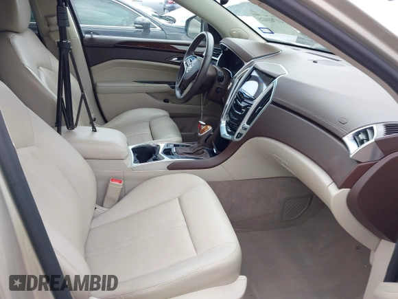 2014 Cadillac SRX Luxury Collection z VIN 3GYFNBE31ES628346, wystawiony jako IAAI lot #41709425 z przebiegiem 47 634 mil mil oraz . Historia ofert i sprzedaży dostępna na DreamBid. Obrazek 5.