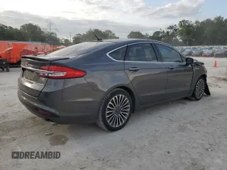 2017 Ford Fusion Titanium z VIN 3FA6P0SU0HR290201, wystawiony jako Copart lot #60106095 z przebiegiem 98 086 mil mil oraz Szkoda całkowita • Salvage title. Historia ofert i sprzedaży dostępna na DreamBid. Obrazek 3.