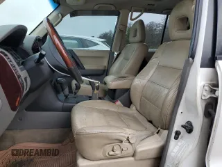 2002 Mitsubishi Montero Limited z VIN JA4MW51R52J027289, wystawiony jako Copart lot #71921024 z przebiegiem 199 334 mil mil oraz Tytuł czysty. Historia ofert i sprzedaży dostępna na DreamBid. Obrazek 7.