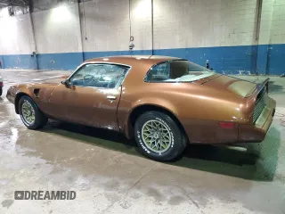 1979 Pontiac Firebird z VIN 2W87K9N184050, wystawiony jako Copart lot #75937874 z przebiegiem 18 509 mil mil oraz Szkody całkowita. Historia ofert i sprzedaży dostępna na DreamBid. Obrazek 2.