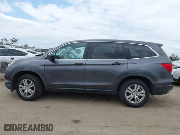 2016 Honda Pilot LX with VIN 5FNYF5H14GB037205, listed as a IAAI auction lot 42034018 with 101,943 mi miles and . Bid and sale history available at DreamBid. Image 14.
