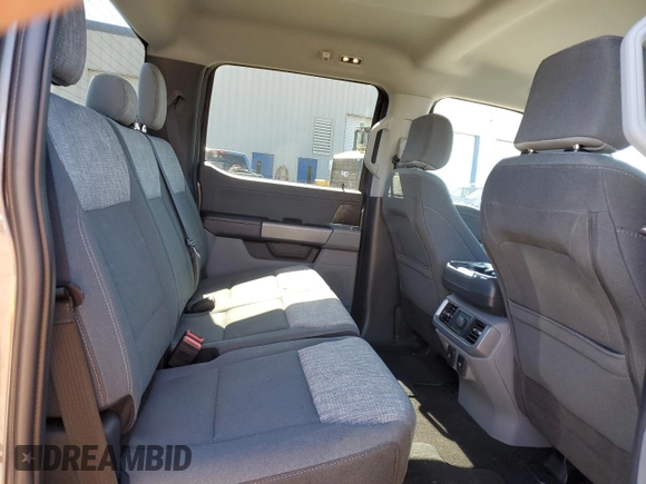 2023 Ford F-150 Lightning Pro z VIN 1FTVW1EL8PWG10894, wystawiony jako Copart lot #50988655 z przebiegiem 34 020 mil mil oraz Szkody całkowita. Historia ofert i sprzedaży dostępna na DreamBid. Obrazek 10.