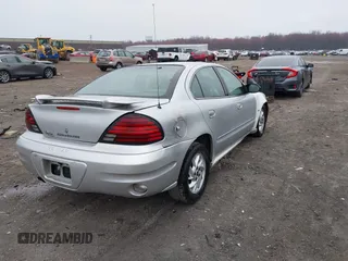 2003 Pontiac Grand Am SE with VIN 1G2NE52F03C323218, listed as a IAAI auction lot 41899309 with 90,195 mi miles. Bid and sale history available at carsss.com. Image 4.