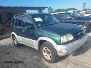 2000 Suzuki Grand Vitara JLX z VIN JS3TD62V3Y4111015, wystawiony jako IAAI lot #42182765 z przebiegiem 145 526 mil mil oraz . Historia ofert i sprzedaży dostępna na DreamBid. Obrazek 1.