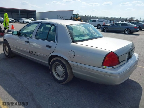 2004 Ford Crown Victoria Standard with VIN 2FAFP73W94X107561, listed as a IAAI auction lot 41804985 with 128,066 mi miles. Bid and sale history available at carsss.com. Image 3.