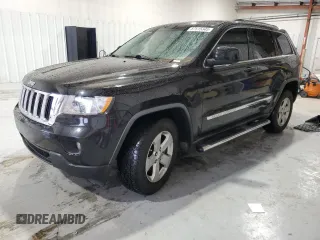 2012 Jeep Grand Cherokee Laredo with VIN 1C4RJEAG4CC146160, listed as a Copart auction lot 87515345 with 116,936 mi miles and Salvage Title. Bid and sale history available at carsss.com. Image 1.