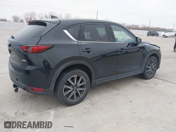 2017 Mazda CX-5 Grand Touring with VIN JM3KFADL9H0110985, listed as a IAAI auction lot 41435143 with 88,208 mi miles. Bid and sale history available at carsss.com. Image 4.