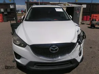 2014 Mazda CX-5 Touring with VIN JM3KE2CY7E0364311, listed as a IAAI auction lot 42108176 with 90,506 mi miles and . Bid and sale history available at DreamBid. Image 12.