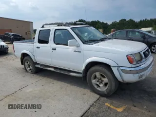 2000 Nissan Frontier XE with VIN 1N6ED27T1YC385792, listed as a Copart auction lot 62268225 with 291,906 mi miles and Salvage title. Bid and sale history available at DreamBid. Image 4.