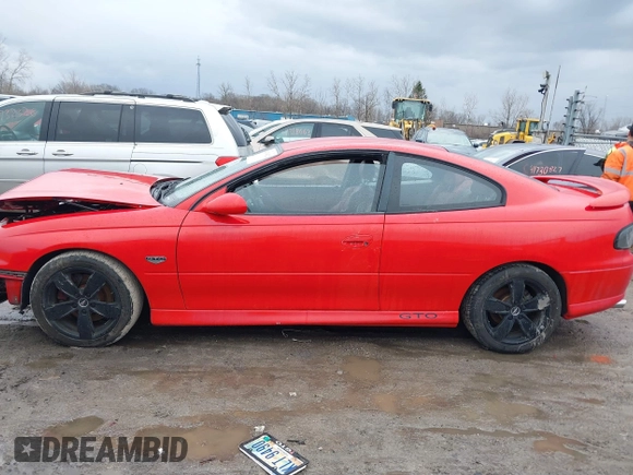 2004 Pontiac GTO z VIN 6G2VX12G34L221749, wystawiony jako IAAI lot #41679612 z przebiegiem Nie podano mil oraz . Historia ofert i sprzedaży dostępna na DreamBid. Obrazek 13.