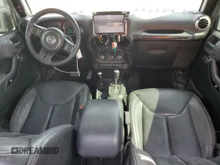 2016 Jeep Wrangler Unlimited Rubicon with VIN 1C4BJWFG8GL192077, listed as a Copart auction lot 58339005 with 62,076 mi miles and Salvage title. Bid and sale history available at DreamBid. Image 8.