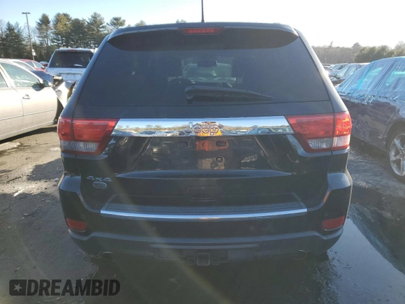 2013 Jeep Grand Cherokee Overland with VIN 1C4RJFCTXDC525097, listed as a Copart auction lot 42250875 with 214,368 mi miles and Salvage Title. Bid and sale history available at carsss.com. Image 6.