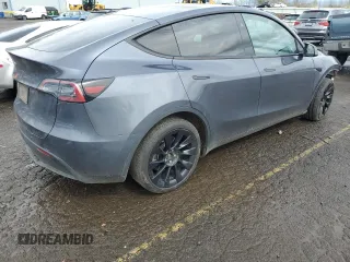 2023 Tesla Model Y Long Range z VIN 7SAYGDEE1PF937867, wystawiony jako Copart lot #51615195 z przebiegiem 88 912 mil mil oraz Szkoda całkowita • Salvage title. Historia ofert i sprzedaży dostępna na DreamBid. Obrazek 3.