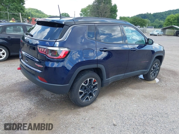 2021 Jeep Compass Trailhawk with VIN 3C4NJDDB0MT590442, listed as a IAAI auction lot 42543530 with 66,669 mi miles and . Bid and sale history available at DreamBid. Image 4.