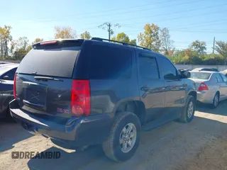2011 GMC Yukon SLE with VIN 1GKS2AE04BR207818, listed as a IAAI auction lot 40669731 with 312,959 mi miles. Bid and sale history available at carsss.com. Image 4.