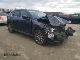 2020 Mazda CX-5 Grand Touring with VIN JM3KFADM4L1783968, listed as a Copart auction lot 85994244 with 89,074 mi miles and Salvage Title. Bid and sale history available at DreamBid. Image 4.