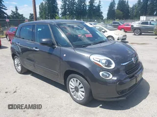 2014 FIAT 500L Easy z VIN ZFBCFABH0EZ028102, wystawiony jako IAAI lot #42721149 z przebiegiem 115 137 mil mil oraz . Historia ofert i sprzedaży dostępna na DreamBid. Obrazek 1.