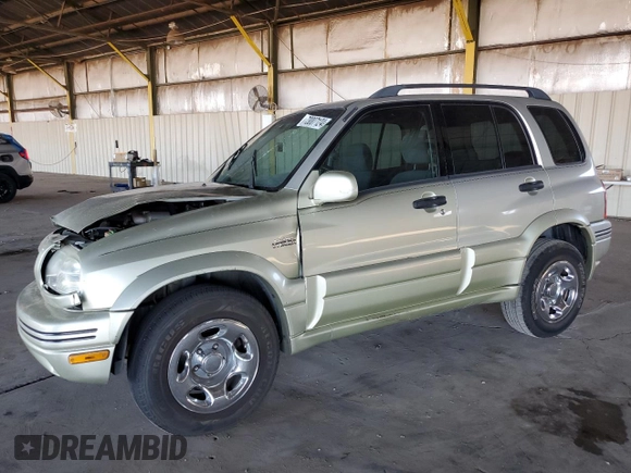 1999 Suzuki Grand Vitara JLX z VIN JS3TD62V3X4123048, wystawiony jako Copart lot #73007124 z przebiegiem 159 828 mil mil oraz Szkoda całkowita • Salvage title. Historia ofert i sprzedaży dostępna na DreamBid. Obrazek 1.