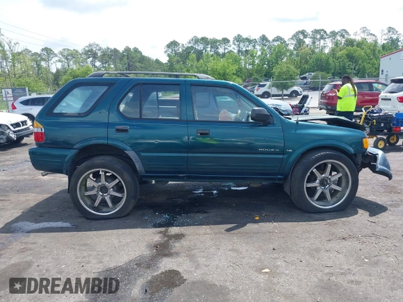 1999 Isuzu Rodeo S with VIN 4S2CK58W6X4332027, listed as a IAAI auction lot 42087396 with 258,508 mi miles and . Bid and sale history available at DreamBid. Image 12.